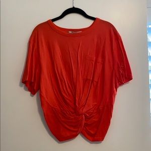 T by Alexander Wang crop tee in orange.